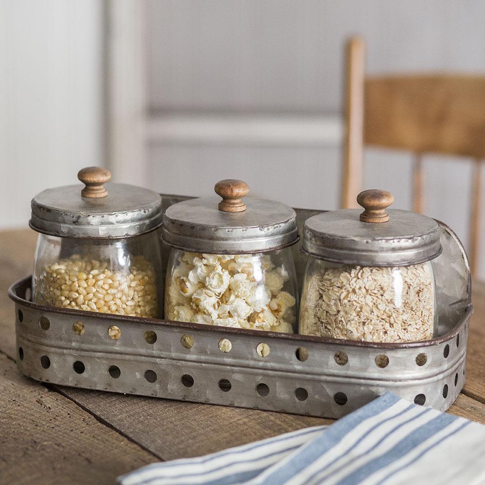 Three Glass Canisters With Storage Bin